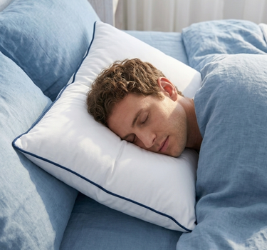 Labham Loft Pillow shown at a three-quarter angle, ultra-soft white micro peach bed pillow, 46 x 71 cm